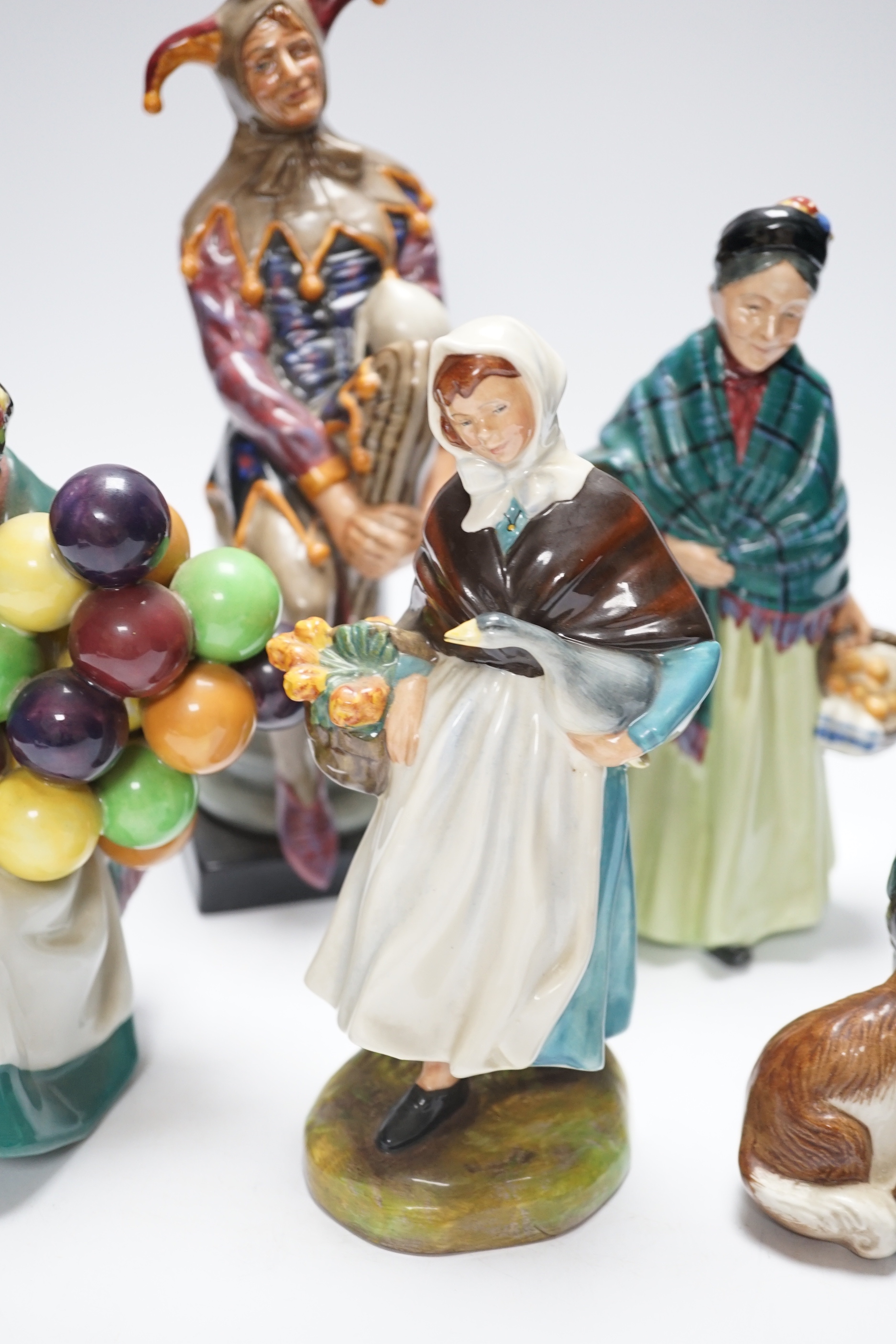 Six Doulton figurines, The Jester, Country Lass, The Master, The Orange Lady, The Old Ballon Seller and Biddy Pennyfarthing, tallest 24cm high